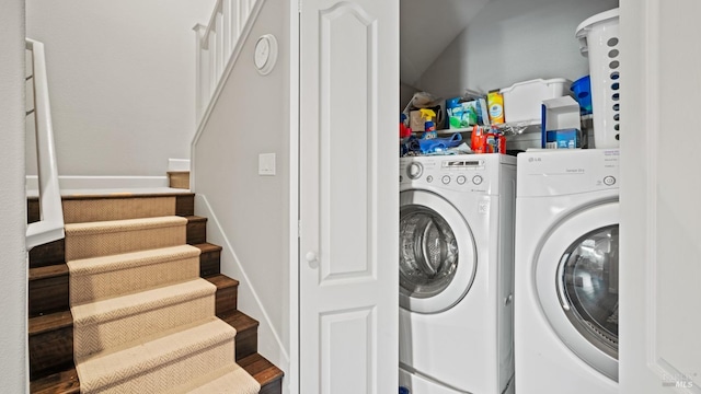 laundry room featuring independent washer and dryer and dark hardwood / wood-style floors