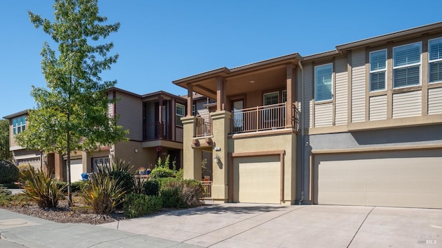 view of front of house with a balcony and a garage