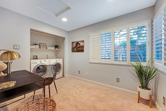 carpeted office featuring washing machine and dryer