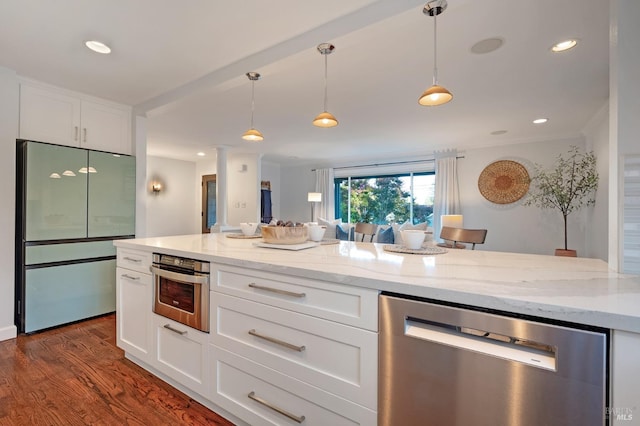 kitchen with light stone counters, appliances with stainless steel finishes, dark hardwood / wood-style floors, and white cabinetry