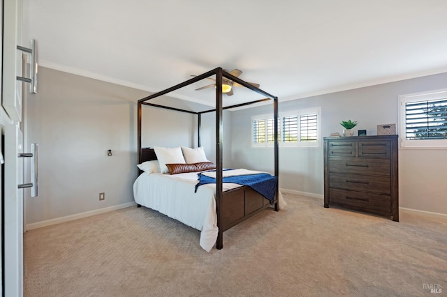 carpeted bedroom featuring ornamental molding, multiple windows, and ceiling fan