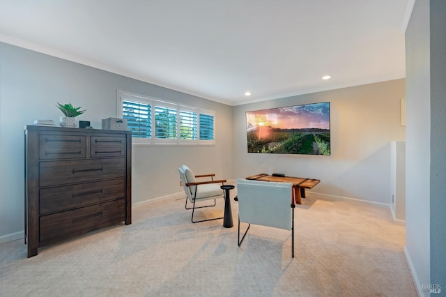 rec room with ornamental molding and light colored carpet