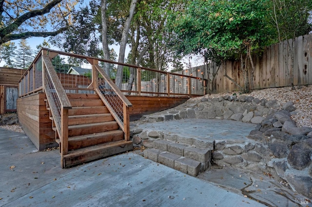 wooden terrace featuring a patio area