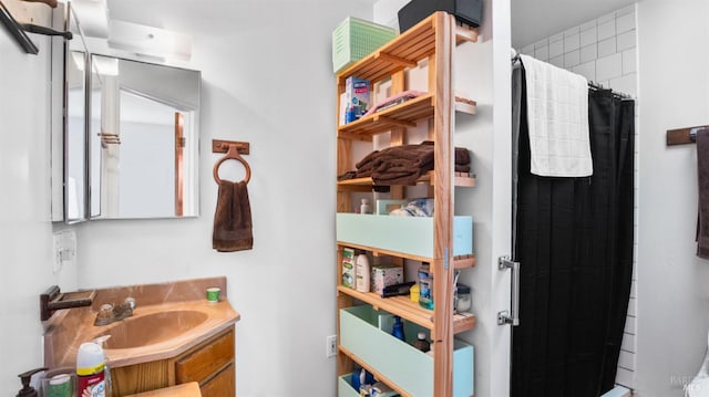 bathroom with vanity and curtained shower