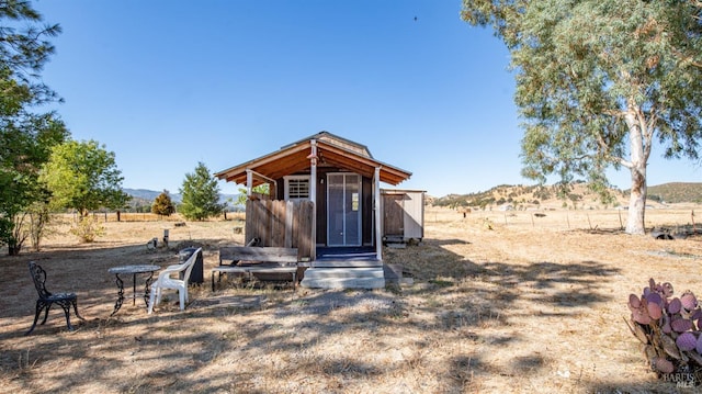 view of outbuilding with a rural view