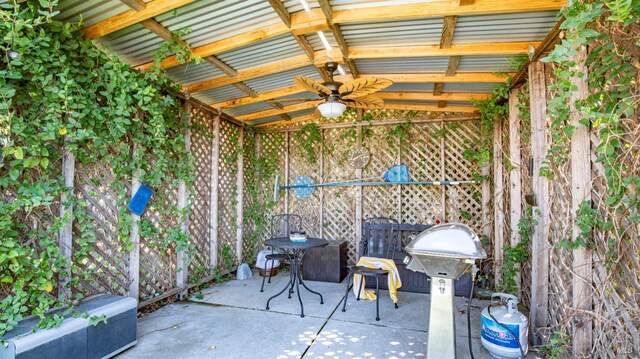 view of patio with a grill and ceiling fan