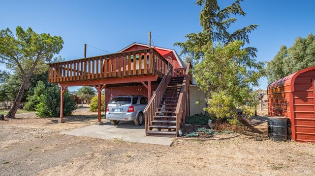 view of front of home featuring a wooden deck