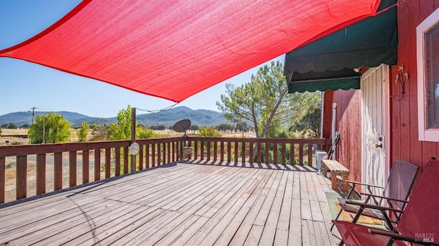 wooden terrace with a mountain view