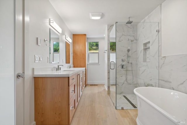 bathroom featuring vanity, tile walls, and separate shower and tub