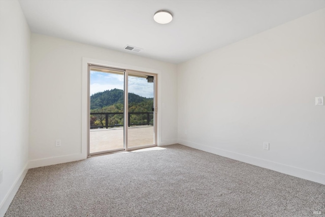 empty room featuring carpet flooring