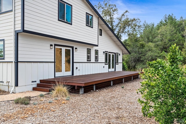 back of property featuring a wooden deck and french doors