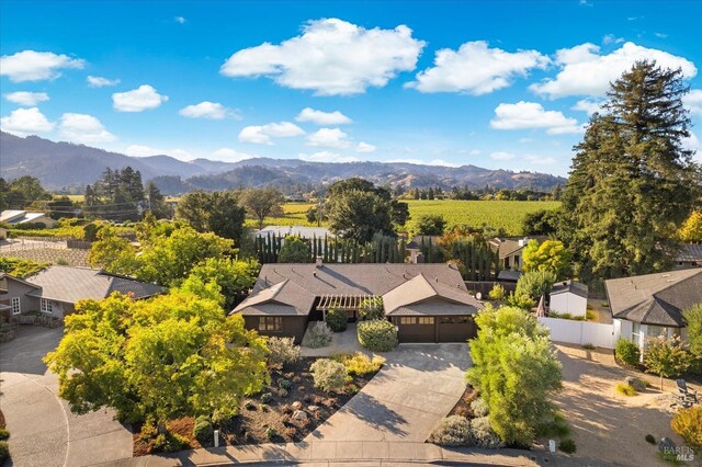 birds eye view of property featuring a mountain view