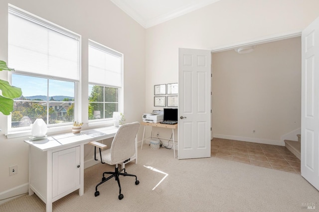 office area featuring light carpet and crown molding