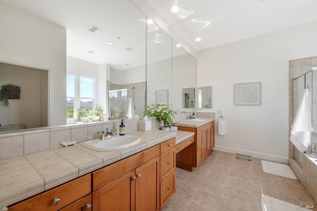 bathroom featuring tile patterned floors, vanity, and an enclosed shower