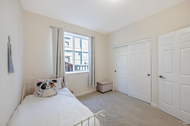 carpeted bedroom featuring a closet