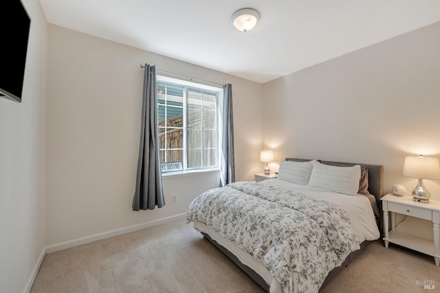 bedroom with light colored carpet