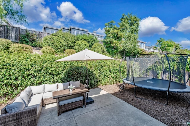 view of patio with outdoor lounge area and a trampoline