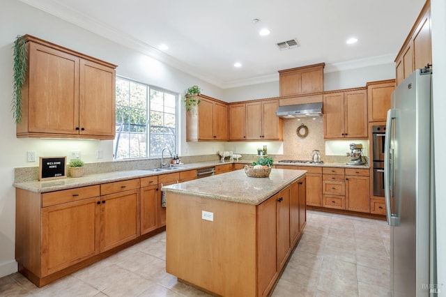 kitchen featuring sink, stainless steel appliances, crown molding, extractor fan, and a kitchen island