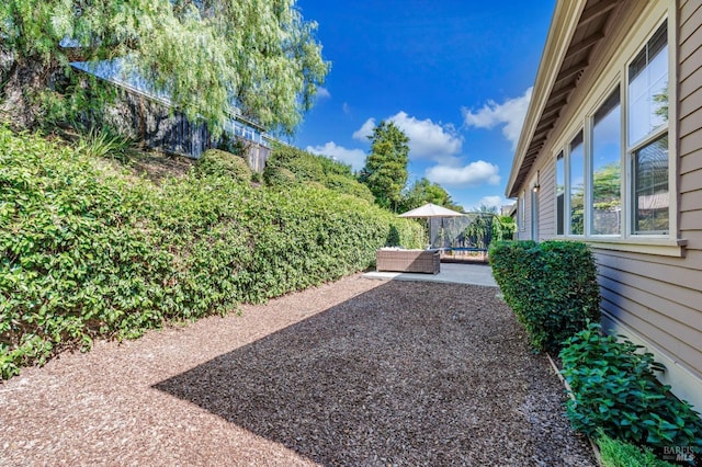 view of yard with an outdoor living space and a patio