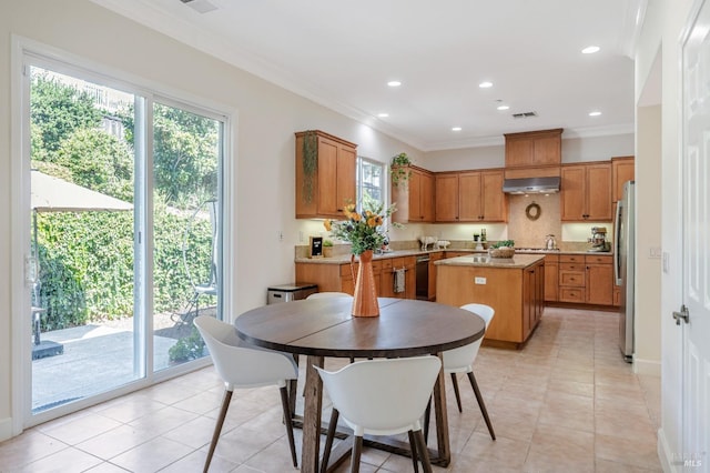 tiled dining room with crown molding