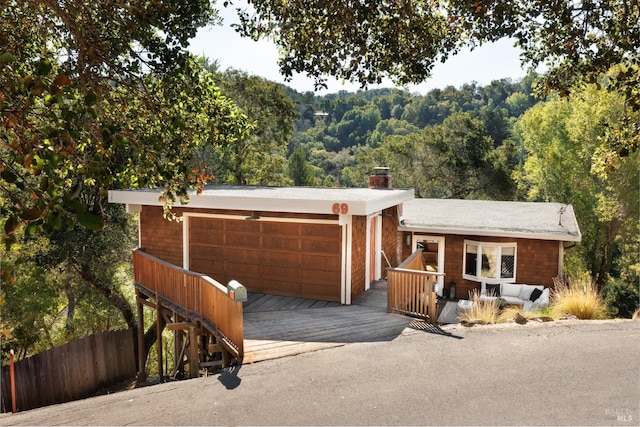 ranch-style house featuring a wooden deck