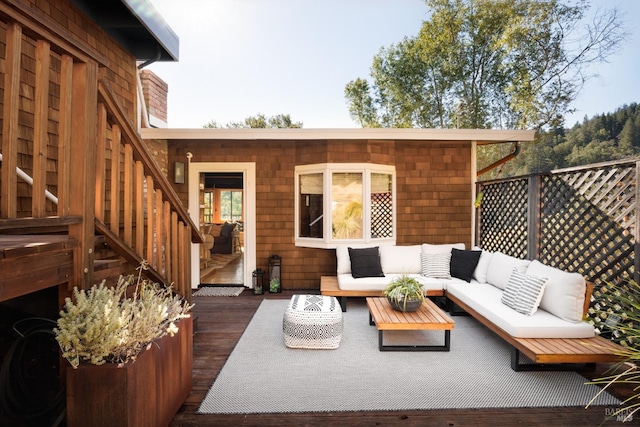 wooden terrace with outdoor lounge area