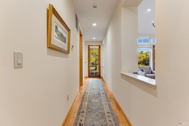 corridor featuring recessed lighting, visible vents, and light wood-type flooring