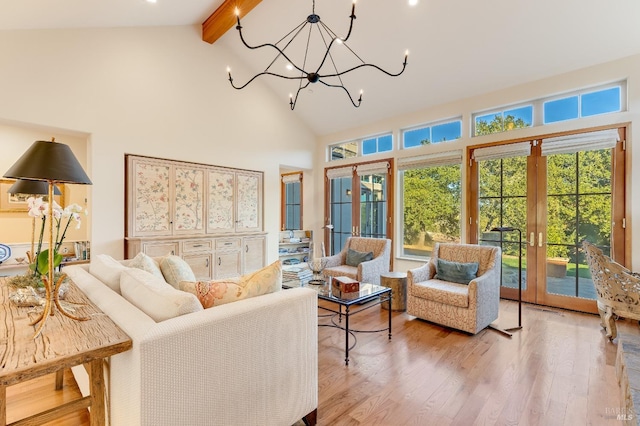 living area featuring beam ceiling, french doors, light wood-style flooring, and high vaulted ceiling