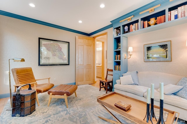 living area with baseboards, crown molding, recessed lighting, and built in features
