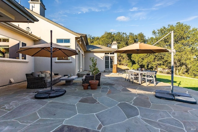 view of patio with outdoor dining area, french doors, and outdoor lounge area
