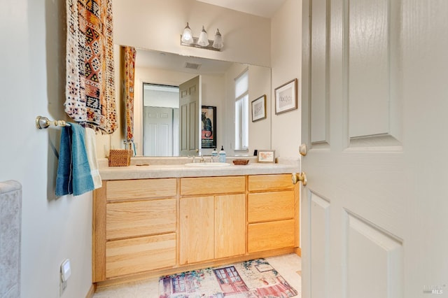 bathroom featuring visible vents and vanity