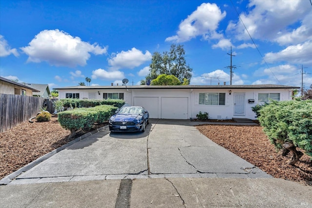 ranch-style home featuring a garage