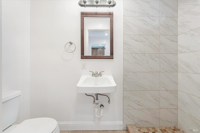 bathroom with sink and toilet