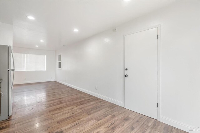 empty room with light hardwood / wood-style floors