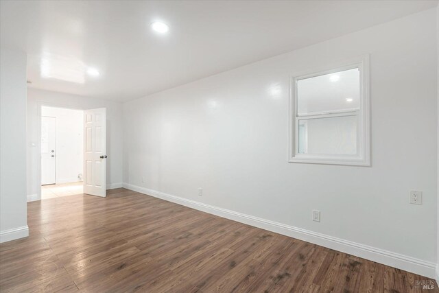 unfurnished room featuring hardwood / wood-style floors