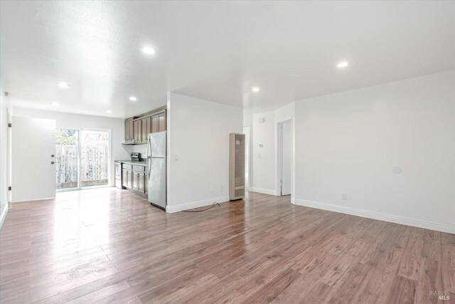 unfurnished living room featuring light hardwood / wood-style flooring