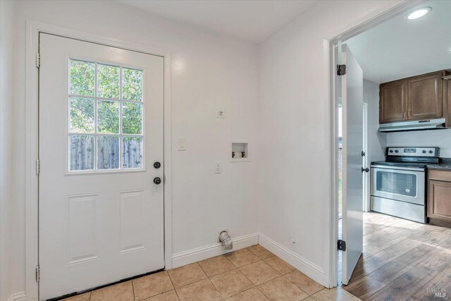 doorway to outside with light wood-type flooring