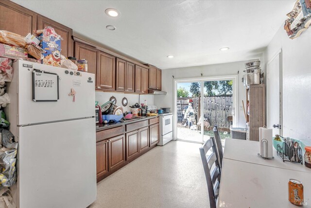 kitchen featuring white appliances and sink