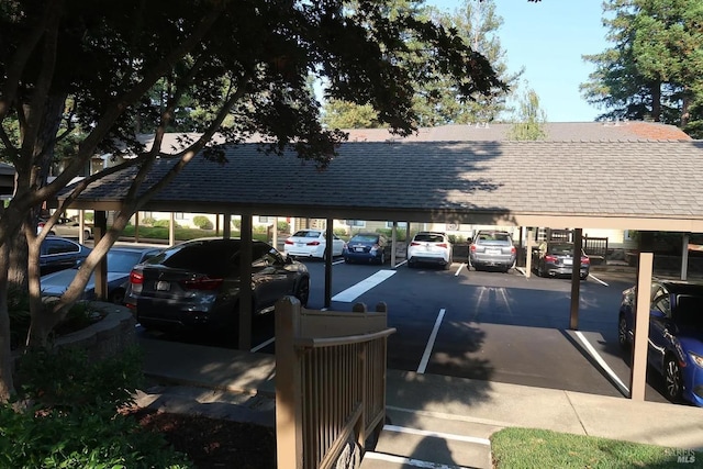 view of vehicle parking with a carport