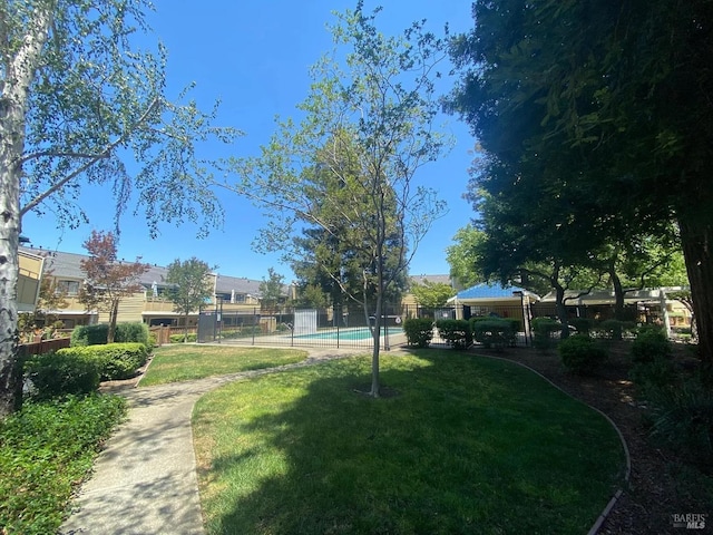 view of yard featuring a community pool