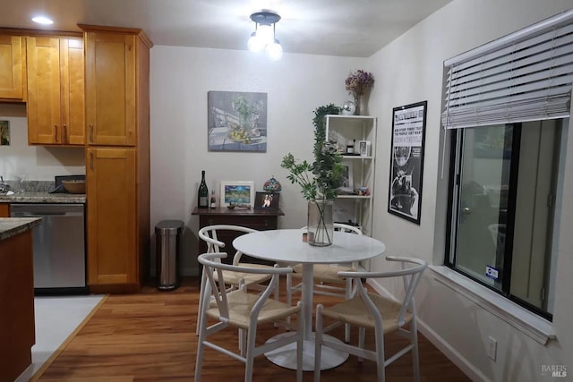 dining space with light wood-type flooring