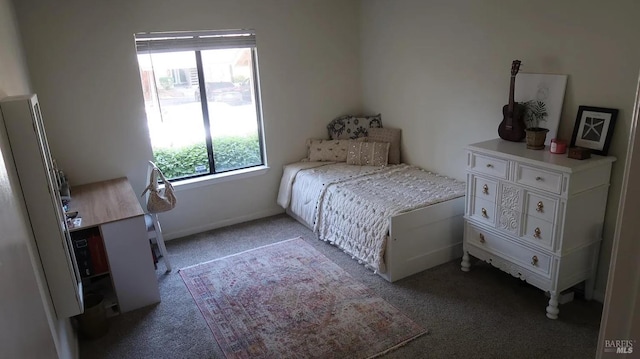 carpeted bedroom with stainless steel fridge