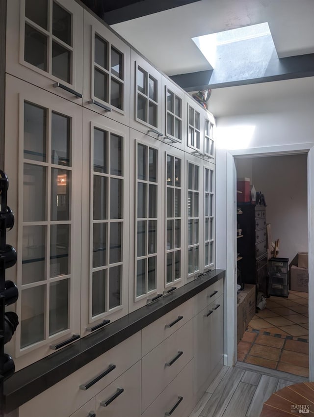 kitchen featuring white cabinets and light hardwood / wood-style flooring