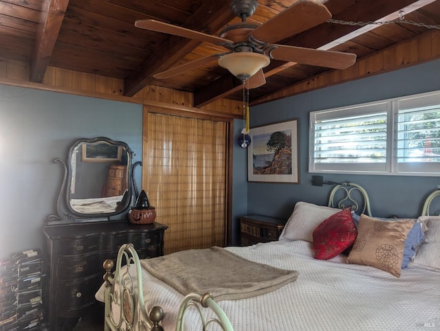 bedroom with wooden ceiling, beamed ceiling, and a ceiling fan