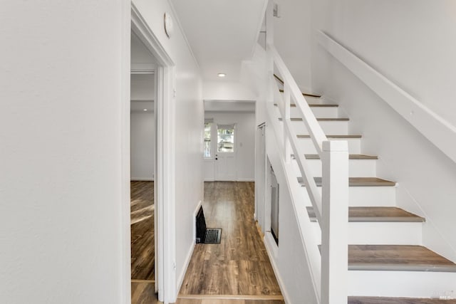 stairs with wood-type flooring