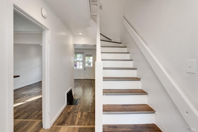 stairway with wood-type flooring