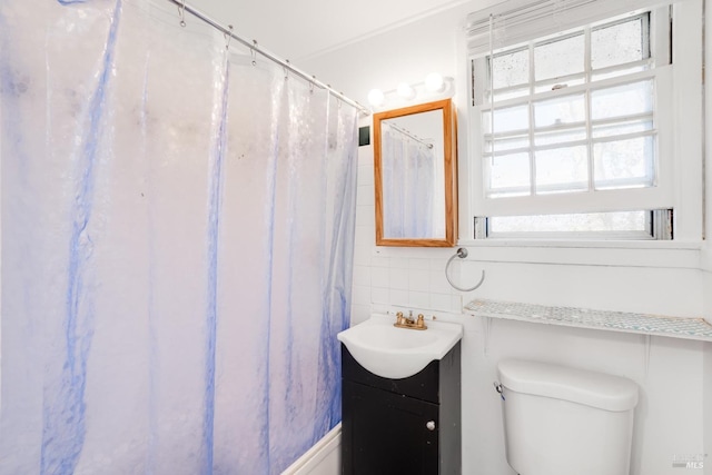 bathroom with vanity, toilet, and a shower with shower curtain