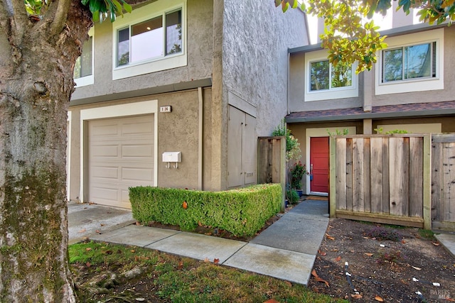 view of exterior entry featuring a garage