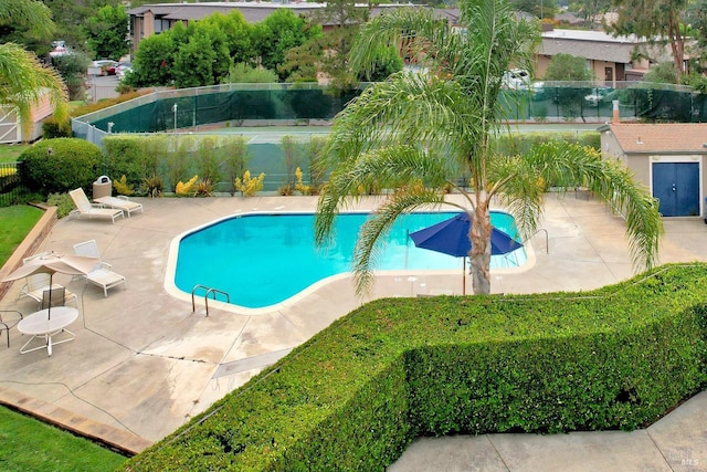 view of swimming pool featuring a patio area