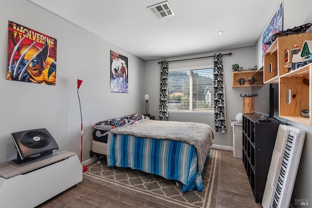 bedroom with dark wood-type flooring